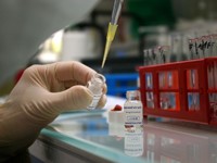 Image of a biologist handling a reagent